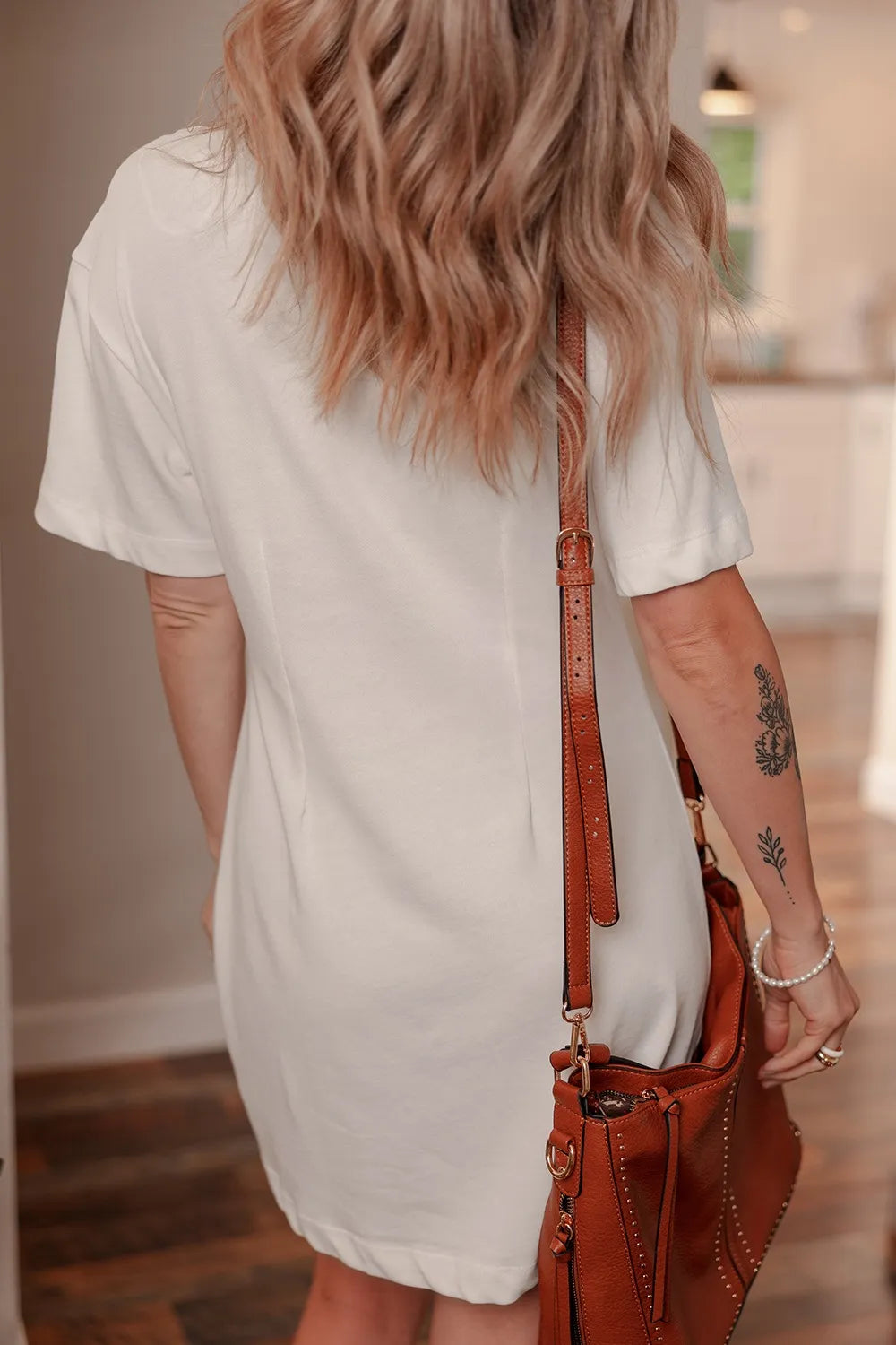Women's cotton drop shoulder crew neck shift T-shirt dress by Trendsi, featuring a relaxed fit and casual style in soft cotton fabric.