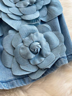 Floral applique strapless denim dress by Trendsi featuring a fitted bodice and floral embellishments on denim fabric.