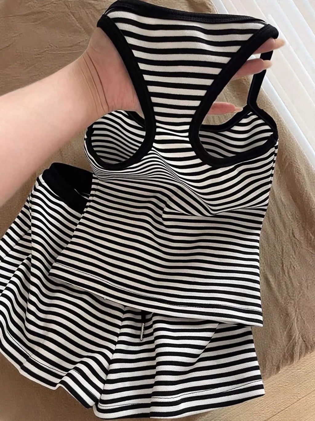Striped tank top and shorts set by Trendsi, featuring a casual summer look with a fitted tank and matching striped shorts.