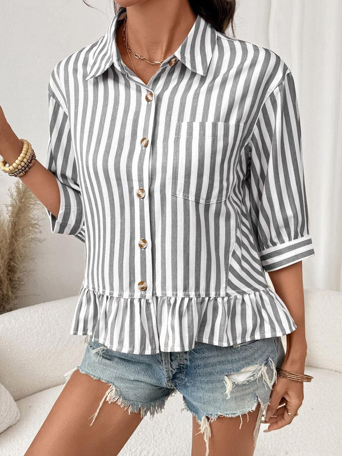 Women's striped button-down blouse with ruffled hem, lightweight viscose fabric, stylish and breathable Trendsi women's top.