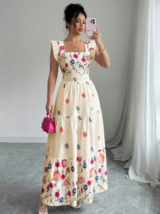 Women’s floral print waist-cinching dress with puff sleeves by FitiqueFit, shown on a model in a stylish outdoor setting.