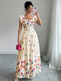 Women’s floral print waist-cinching dress with puff sleeves by FitiqueFit, shown on a model in a stylish outdoor setting.