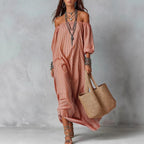 Women's striped loose-fit flared maxi dress by FitiqueFit, featuring a flowing silhouette and vibrant vacation-ready pattern.