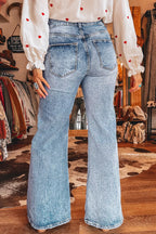 Acid wash flare jeans with pocket details from Shopimist, featuring a high-waisted design and retro-style distressed denim.