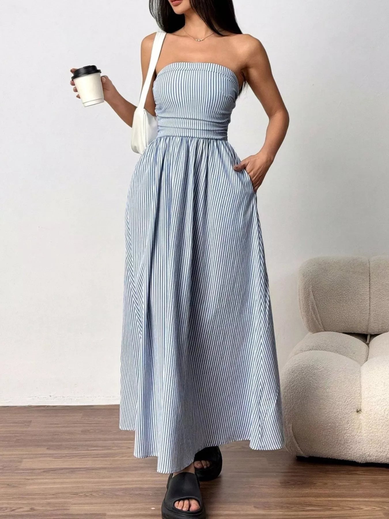 Striped strapless casual maxi dress from Plush Fashion Hub, featuring a flowing design and vibrant color pattern.