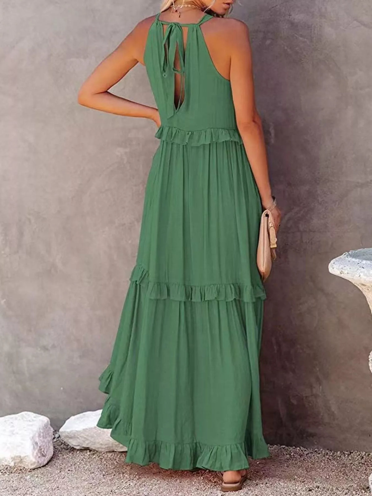 Sleeveless ruffled tiered maxi dress from Plush Fashion Hub with flowing fabric and elegant layered design.