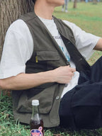 Men's multi-pocket cargo vest from Trendsi with multiple front pockets and adjustable straps, shown in a neutral color.