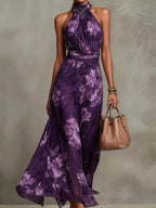 Plus size floral print sleeveless maxi dress from Trendsi, flowing fabric with vibrant floral pattern, perfect for summer wear.