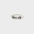 Sterling silver ring with inlaid zircon stones, crafted by Shopimist, showcasing a detailed design and sparkling gemstone accents.