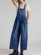 Lightweight raw hem wide-leg denim overalls jumpsuit by Trendsi, casual chic dungarees with relaxed fit and adjustable straps.