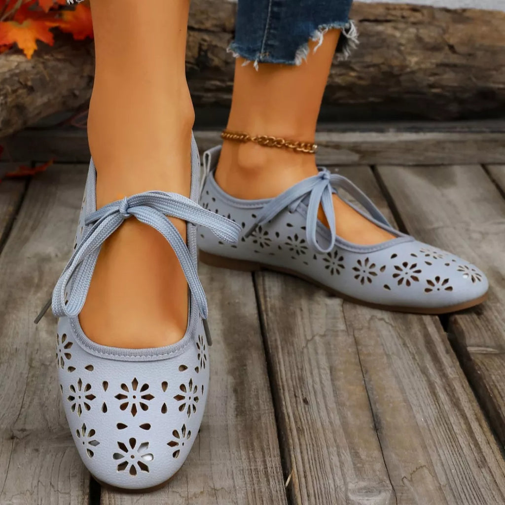 Plush Fashion Hub floral cutout slip-on sandals with tied design, open-toe style, and decorative floral accents.
