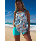 Plus size women's one-piece swimsuit by FitiqueFit featuring a supportive, stylish swimwear design in vibrant colors.