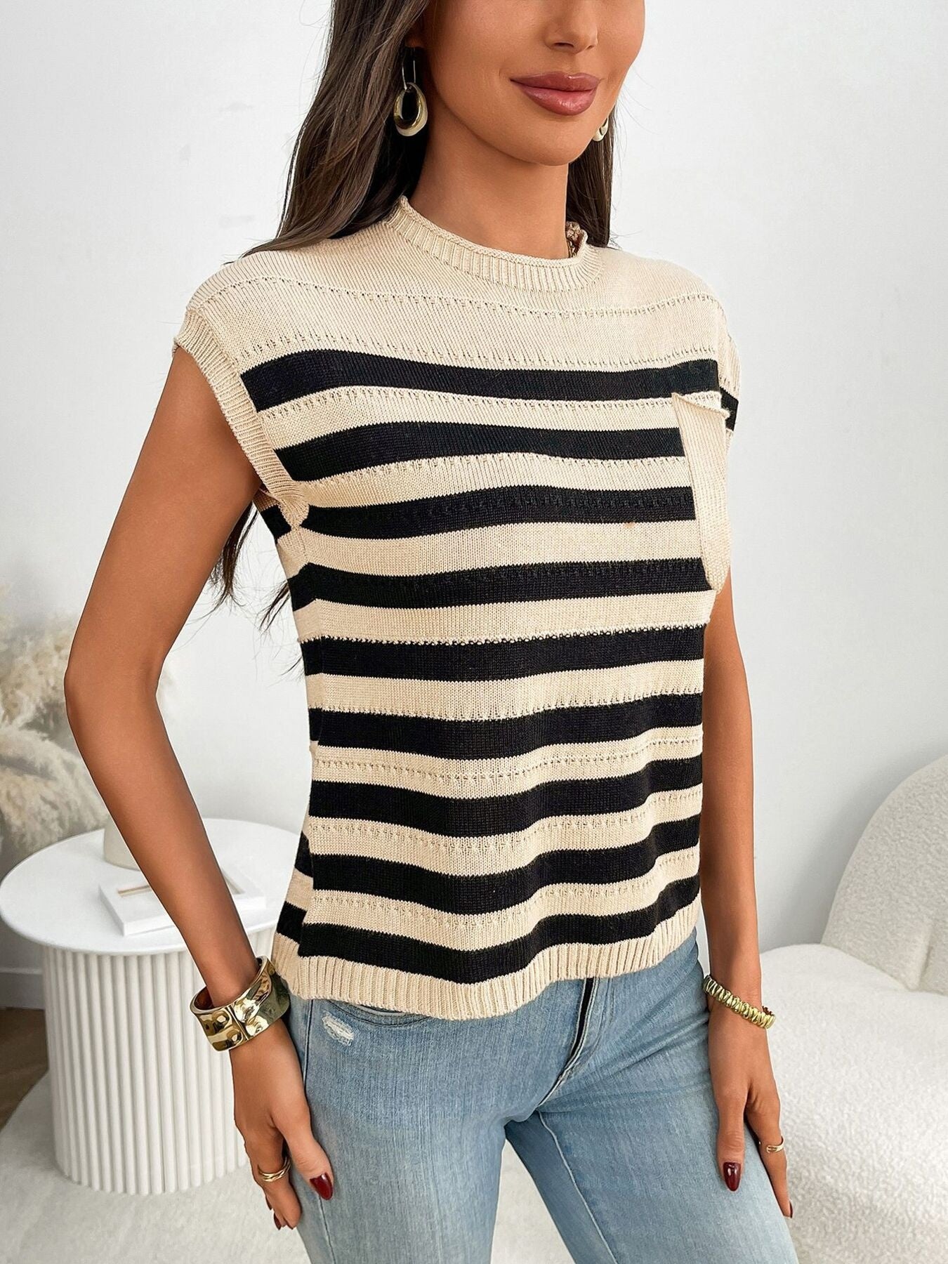 Women's striped knit cap sleeve sweater with pocket detail, trendy outerwear by Trendsi, shown in a cozy, stylish design.