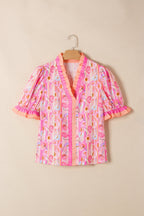 Danna Trim Short Sleeve Blouse by Threaded Pear featuring a stylish design and trim details, shown in a close-up image.