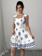 Shopimist printed bow back square neck mini dress featuring a stylish design and feminine bow detail on the back.