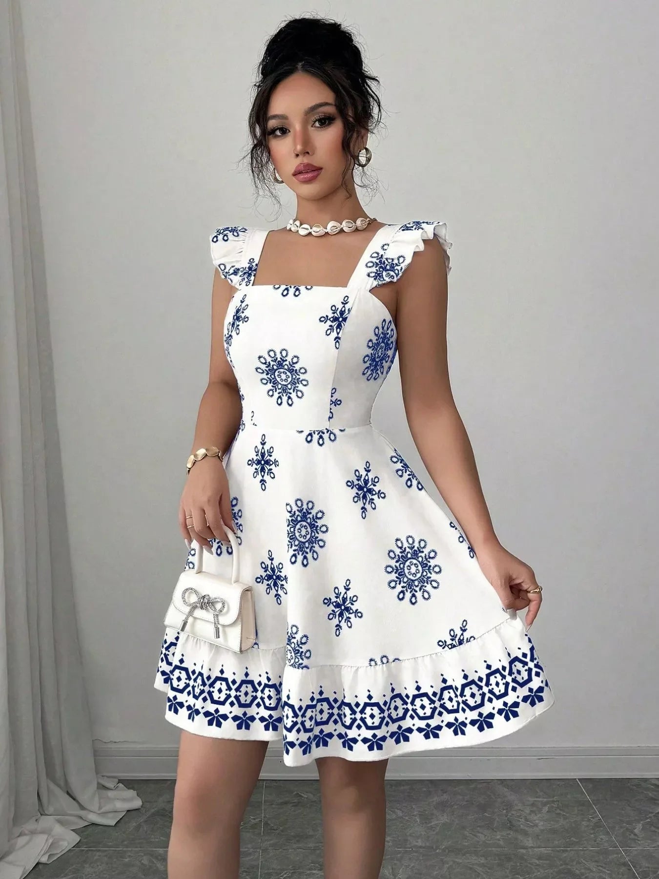 Shopimist printed bow back square neck mini dress featuring a stylish design and feminine bow detail on the back.