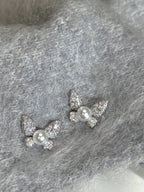 Butterfly-shaped pearl stud earrings by Shopimist featuring elegant white pearls and silver butterfly accents.