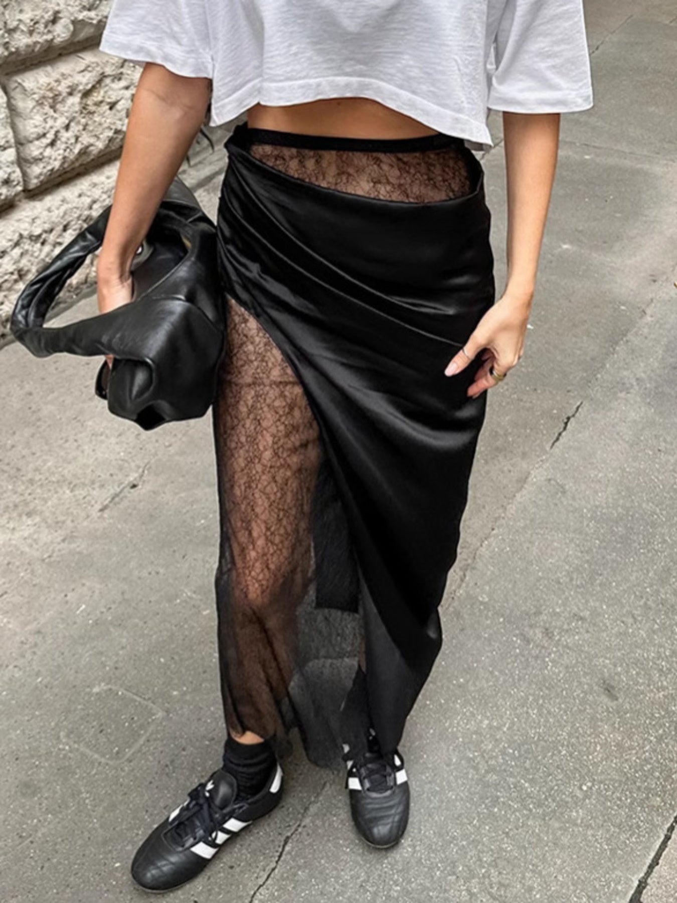 Women's elegant lace midi skirt with sheer split detail, flowing design, and stylish silhouette from Trendsi.