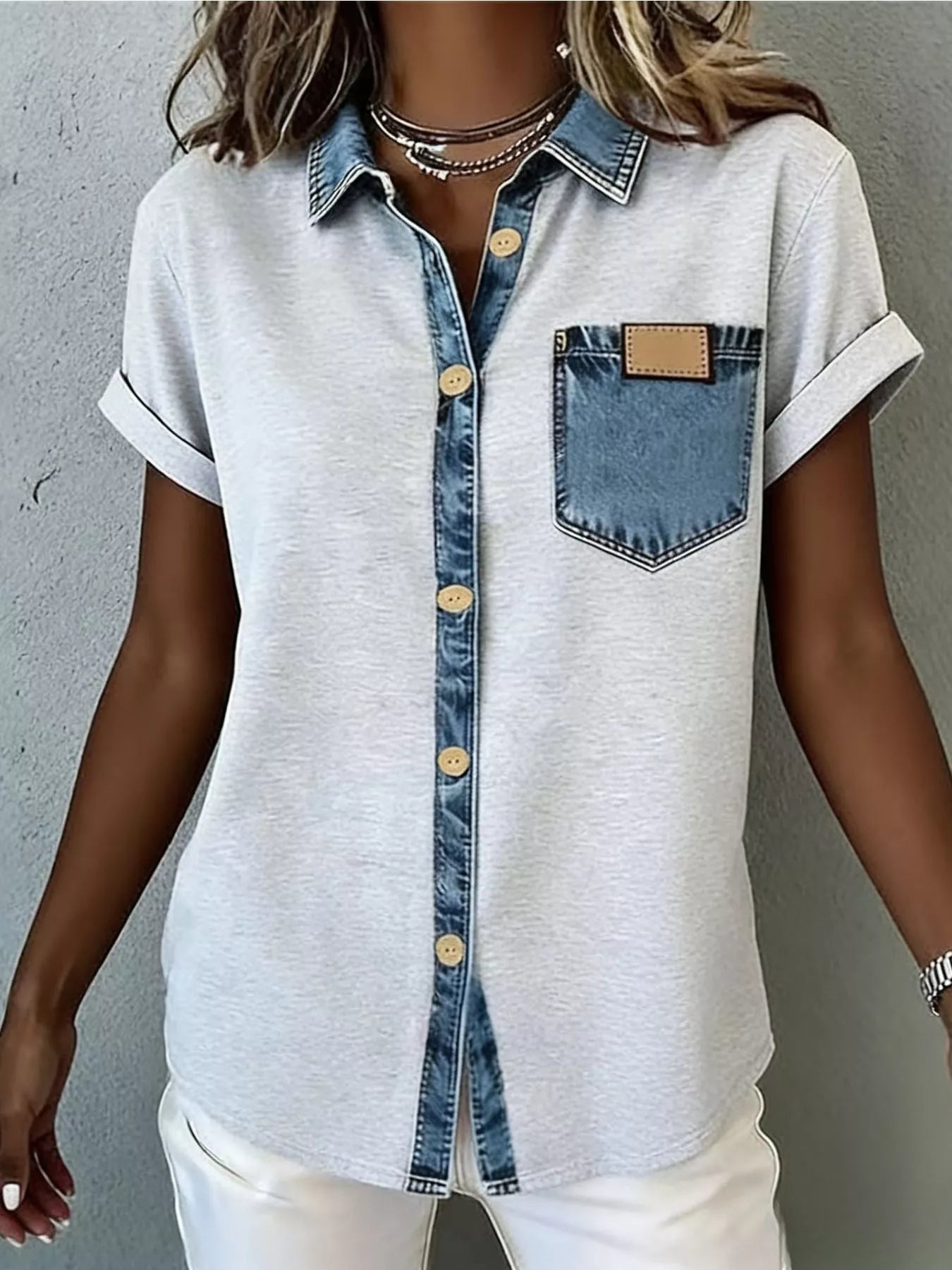Denim trim short sleeve shirt from Plush Fashion Hub, casual top with denim accents and a relaxed fit, displayed on a hanger.