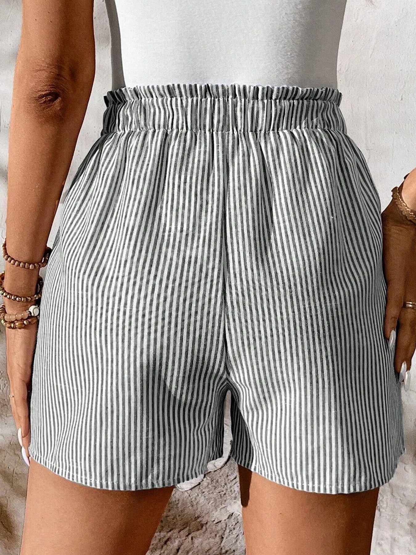 Women's striped elastic waist drawstring shorts by Plush Fashion Hub, casual summer beachwear bottoms with a relaxed fit.