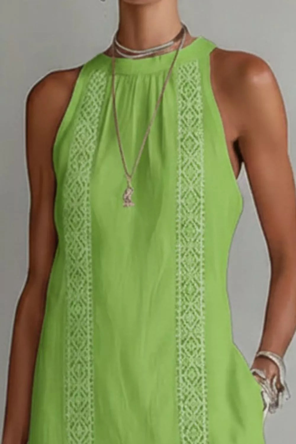 Women’s sleeveless side slit maxi dress with pockets by Plush Fashion Hub, shown in a flowing fabric with a stylish slit and pocket details.