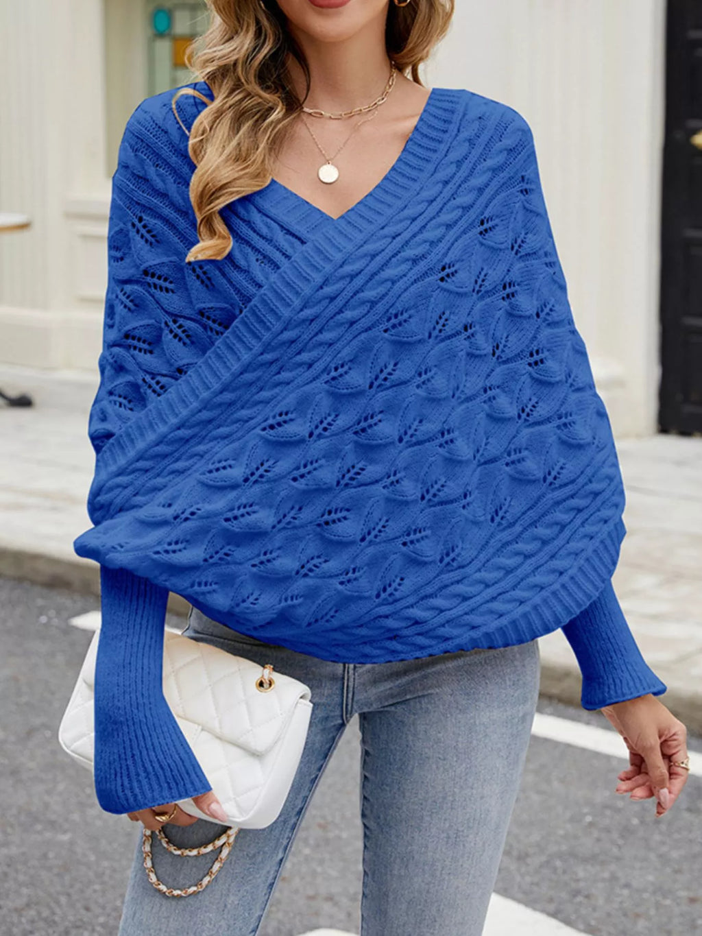 Cream cable knit batwing sleeve sweater from Trendsi, featuring a cozy, textured knit and relaxed fit, ideal for casual wear.