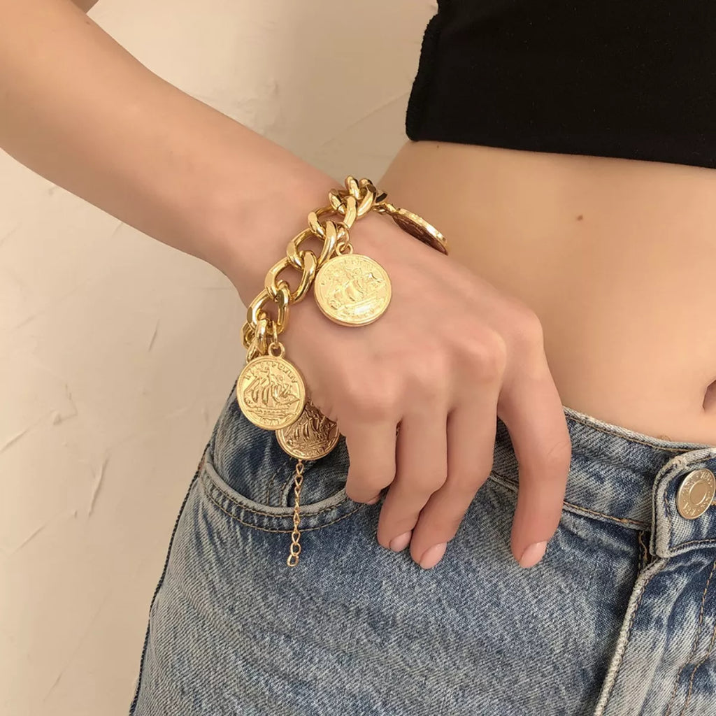 18K gold-plated coin charm bracelet with intricate coin details and delicate chain, stylish jewelry accessory.