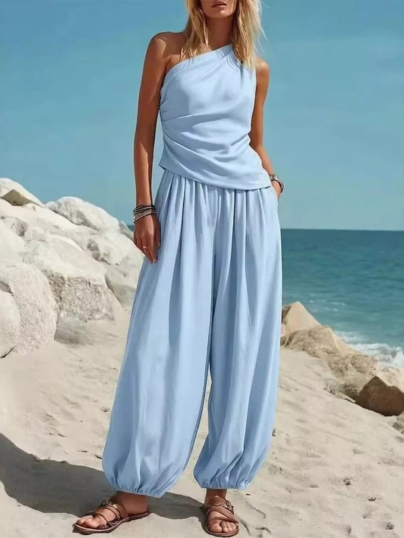 Plus size one-shoulder top and wide-leg pants set from Plush Fashion Hub, featuring a stylish, coordinated outfit for a fashionable look.