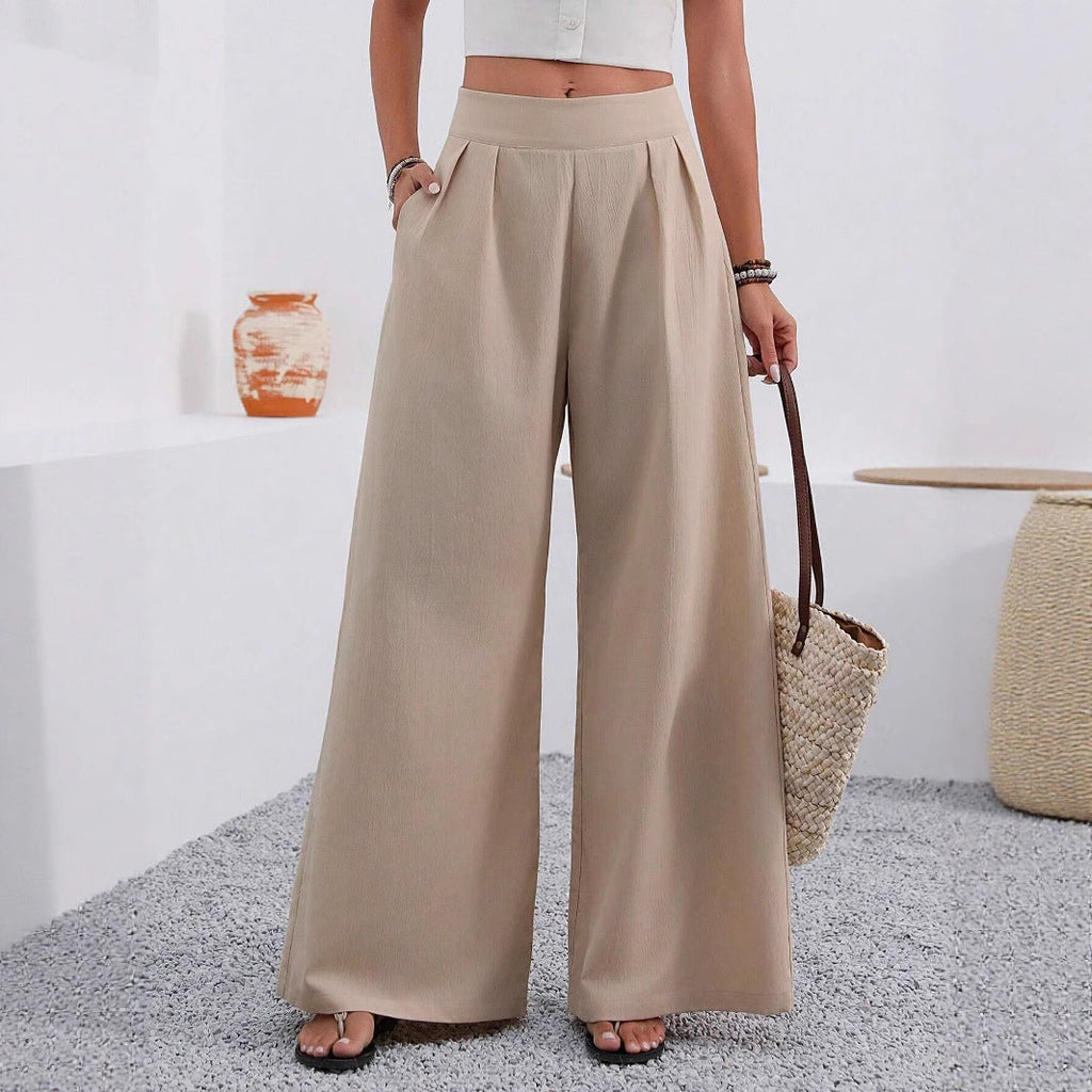 Women's high-waist wide-leg trousers with pockets from Plush Fashion Hub, full length, showcasing relaxed fit and stylish design.