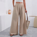 Women's high-waist wide-leg trousers with pockets from Plush Fashion Hub, full length, showcasing relaxed fit and stylish design.