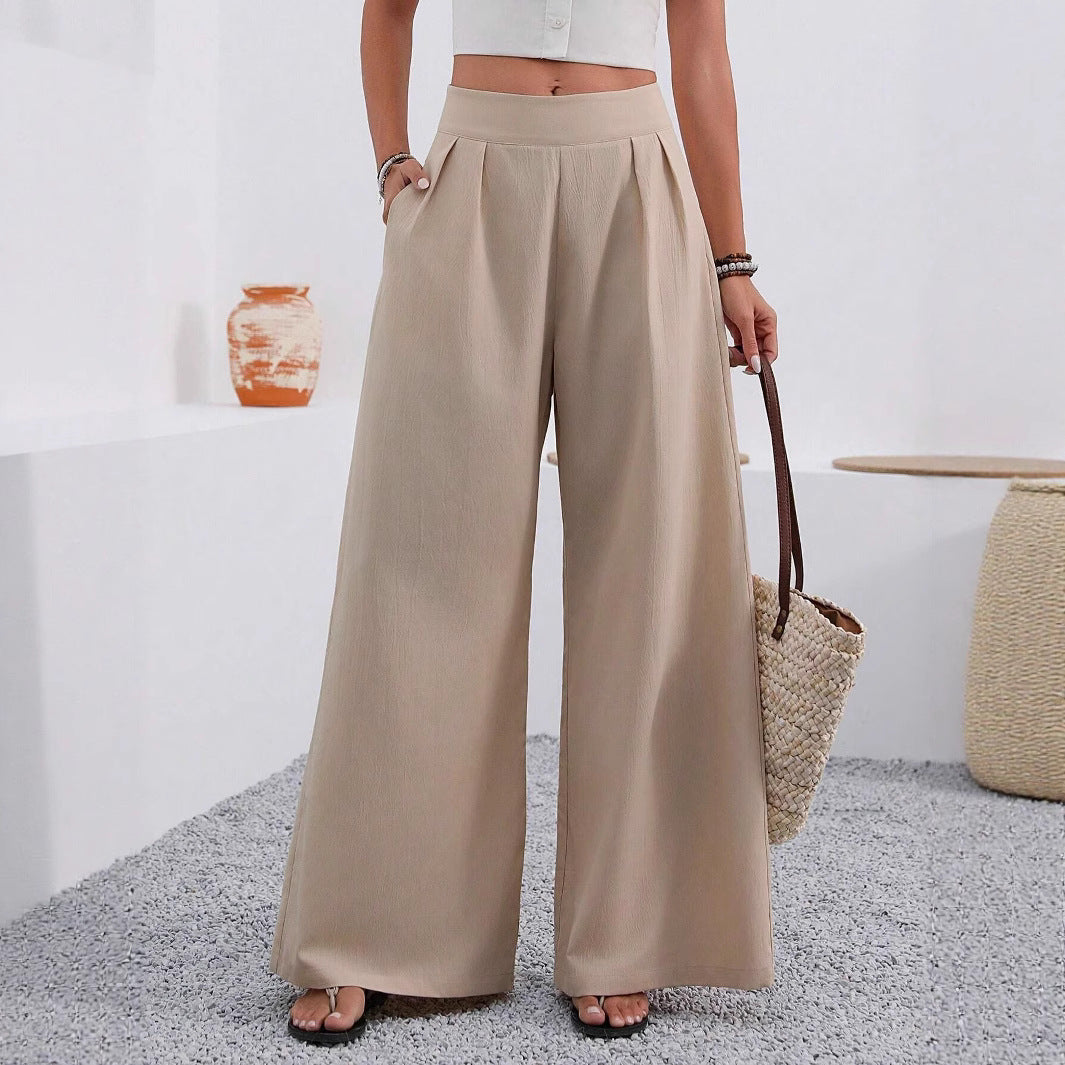 Women's high-waist wide-leg trousers with pockets from Plush Fashion Hub, full length, showcasing relaxed fit and stylish design.