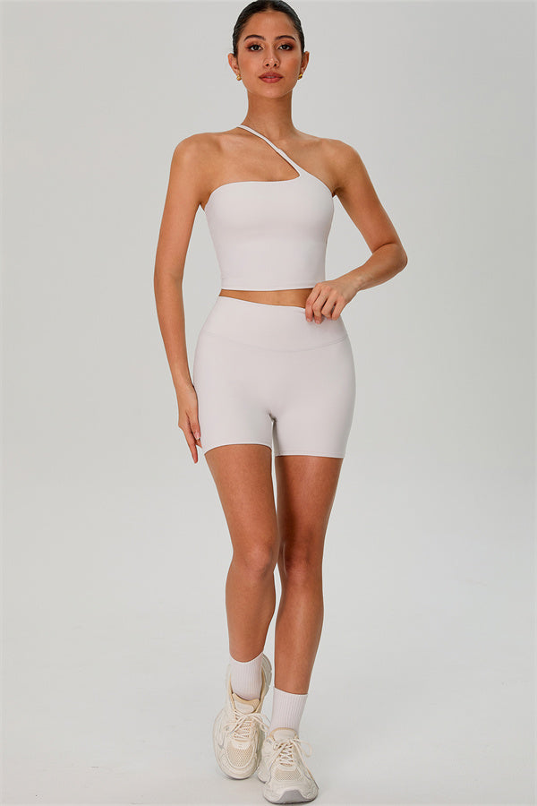 Fitglutes activewear one-shoulder crop top and matching shorts 2-piece set, perfect for gym and workout sessions.