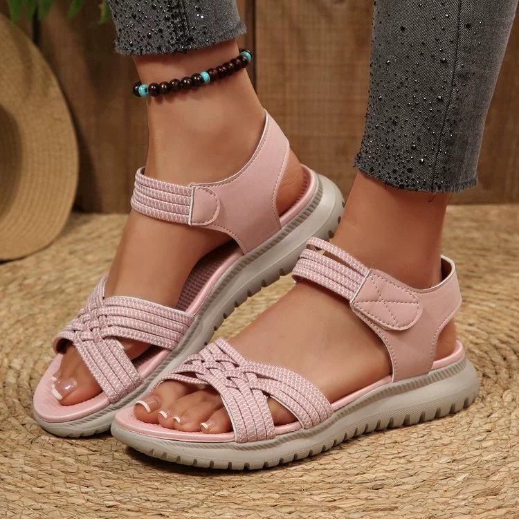 Women's open toe woven strap flat sandals by Trendsi featuring faux leather slides with comfortable, stylish design.