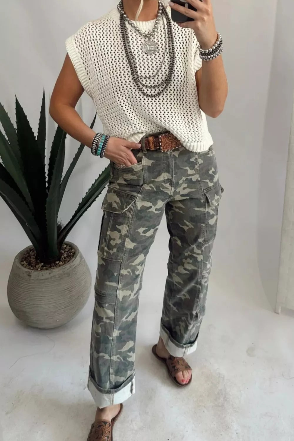 Camouflage print women's denim pants by Shopimist with multiple pockets and a stylish, casual fit.