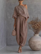 Trendsi one-shoulder top and joggers loungewear set, stylish and comfortable, with soft fabric and modern design.
