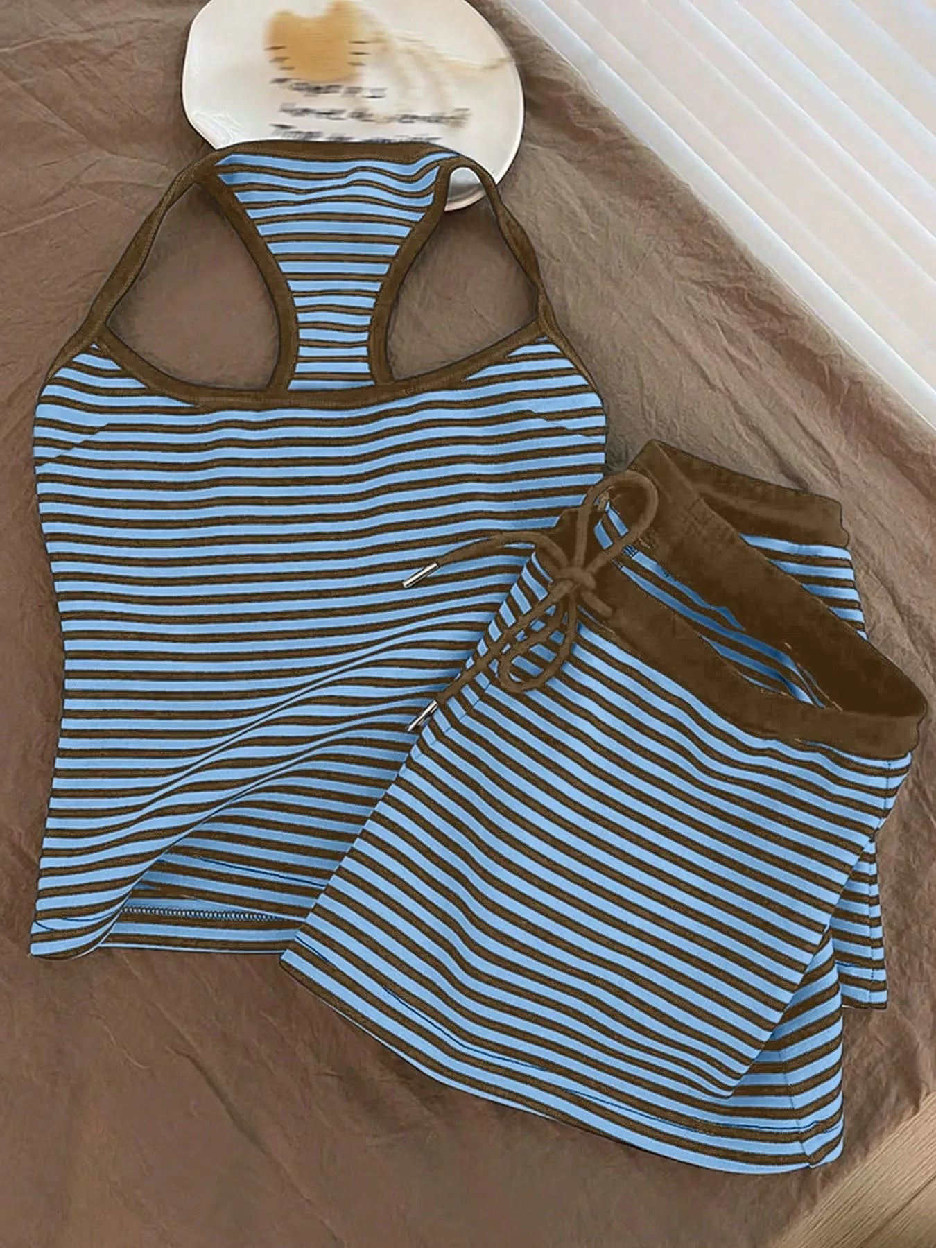 Striped tank top and shorts set from Trendsi, featuring a casual design with a sleeveless tank and matching shorts.