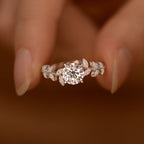 Sterling silver leaf ring with 1 carat moissanite gemstone, elegant jewelry piece showcasing detailed leaf design.