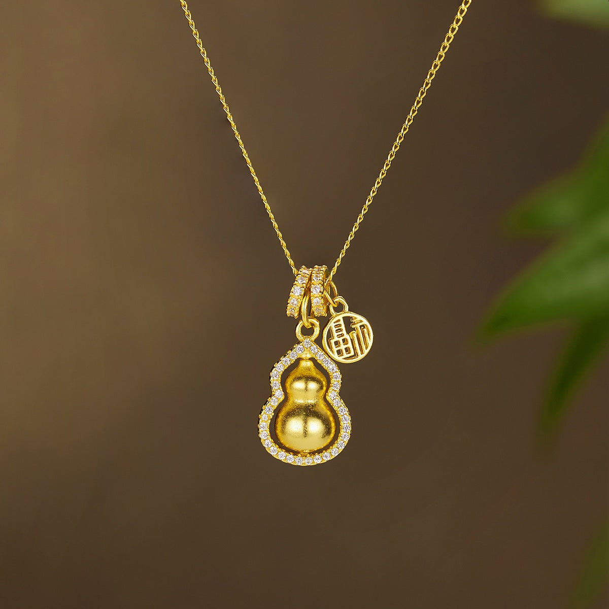 18K gold-plated gourd pendant necklace with intricate design, featuring a delicate chain and elegant craftsmanship.
