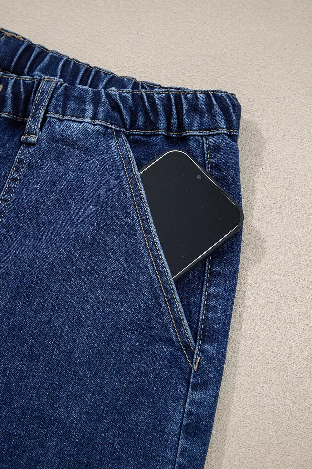 Wide-leg denim pants with drawstring waist, seam details, and raw hem from Plush Fashion Hub, showcasing relaxed, casual style.