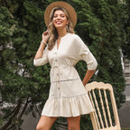 Women's V-neck A-line casual dress by FitiqueFit with three-quarter sleeves and button contrast panel, displayed on a hanger.