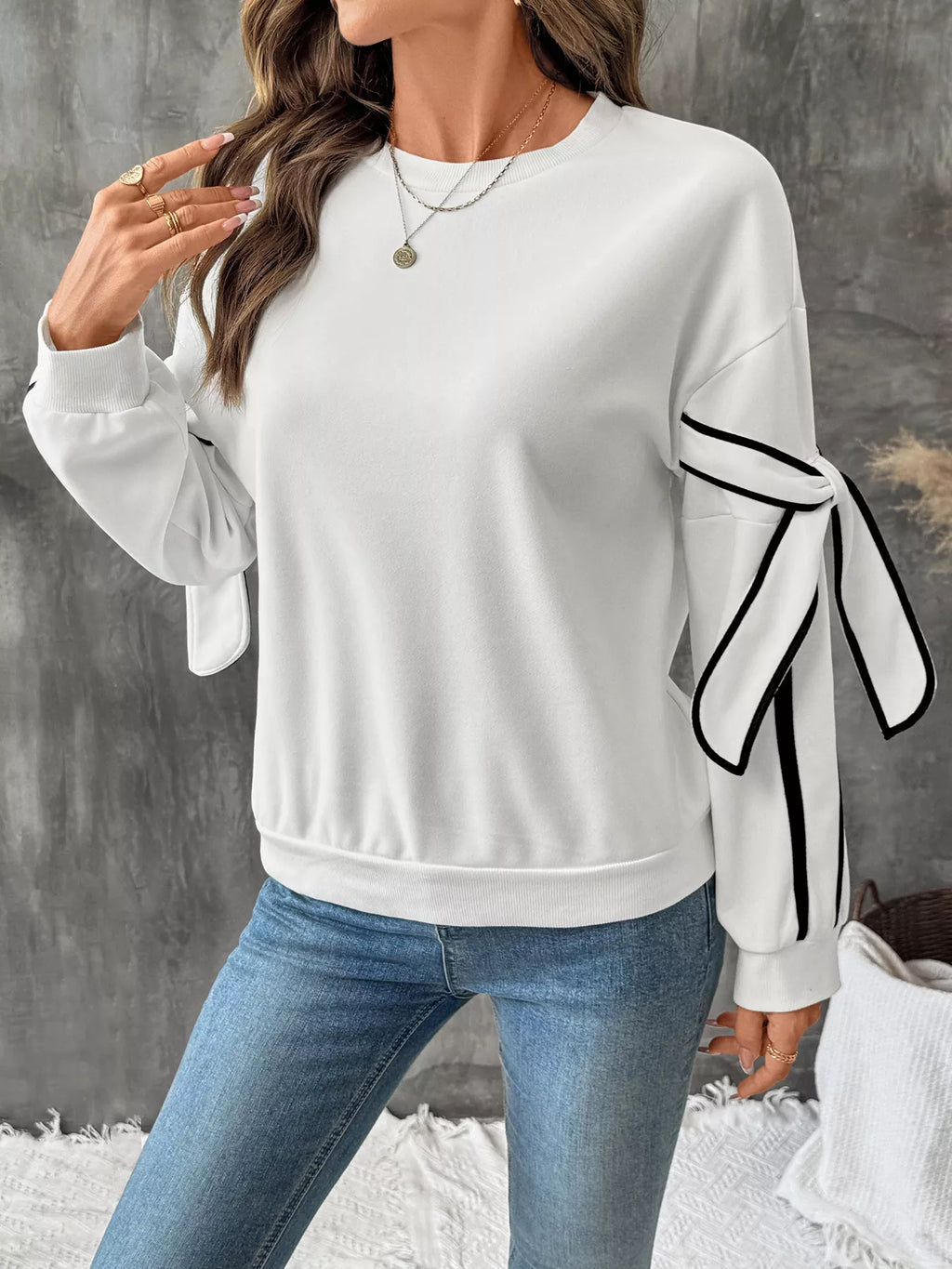 Side striped round neck sweatshirt from Trendsi featuring a casual fit and contrasting stripe details on the sleeves.