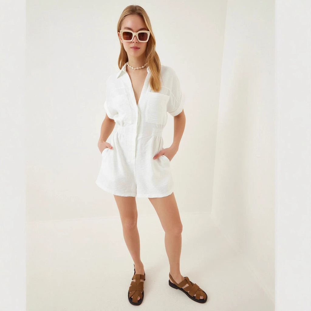 Women's cotton linen loose-fit workwear jumpsuit with pockets, featuring a relaxed fit and functional design by FitiqueFit.