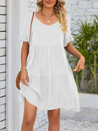 Lightweight rayon mini dress with ruffled sleeves, tiered design, and pockets, featuring a stylish and feminine look.