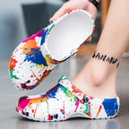 Men's colorful paint splash sandals, trendy footwear by Trendsi with vibrant paint designs and comfortable open-toe style.