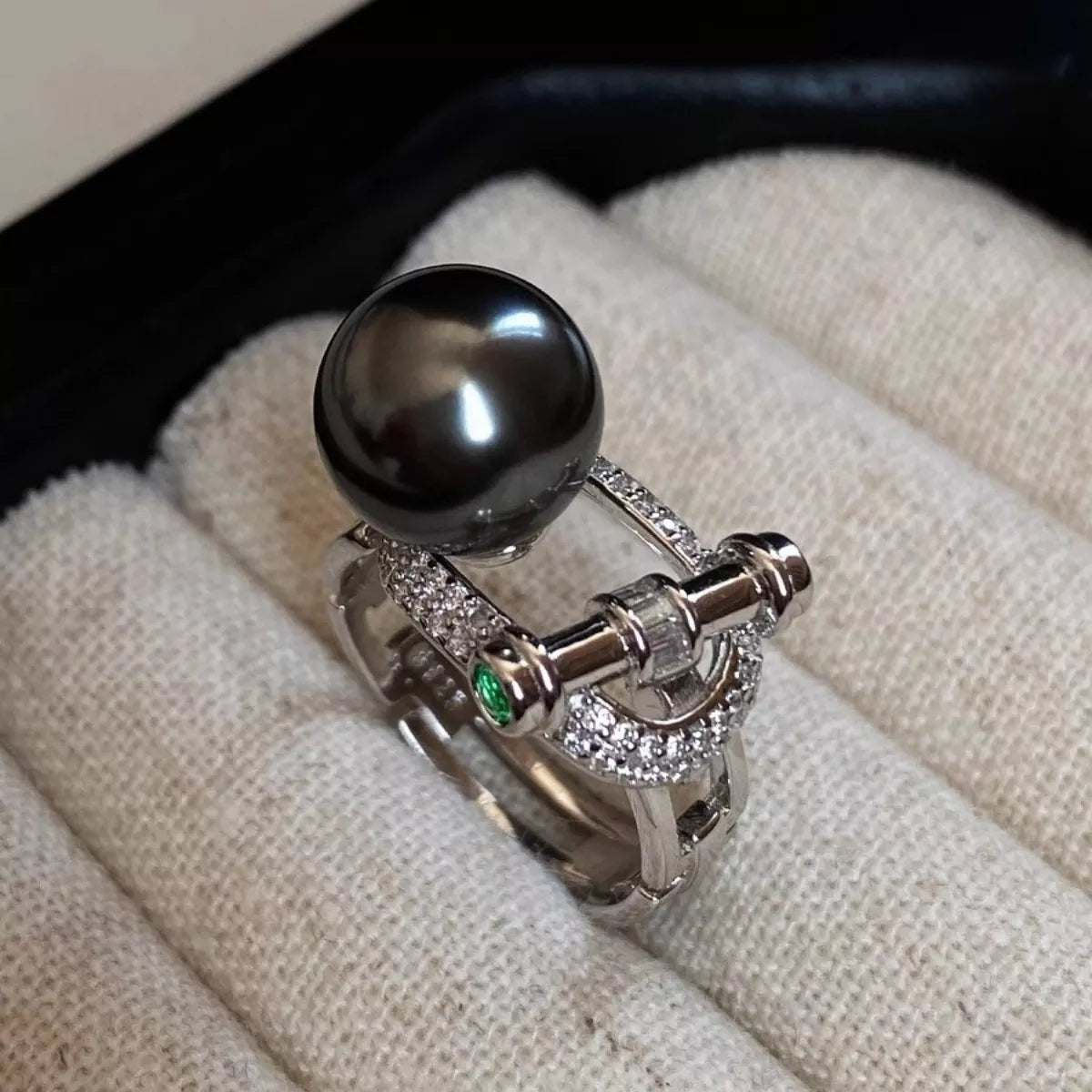 Sterling silver zircon and pearl ring featuring a polished band and elegant design, perfect for stylish jewelry accessories.