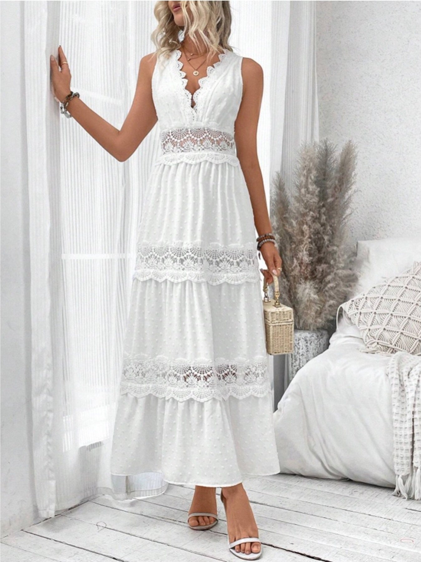 Sleeveless Swiss dot lace maxi dress with ruched tie detail from Trendsi, featuring a flowing silhouette and intricate lace pattern.