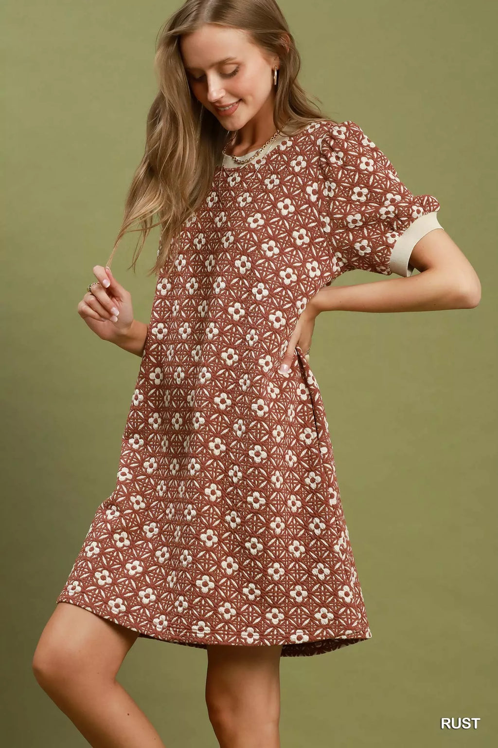 Umgee floral textured puff sleeve mini dress with a fitted bodice and ruffled hem, perfect for spring and summer wear.