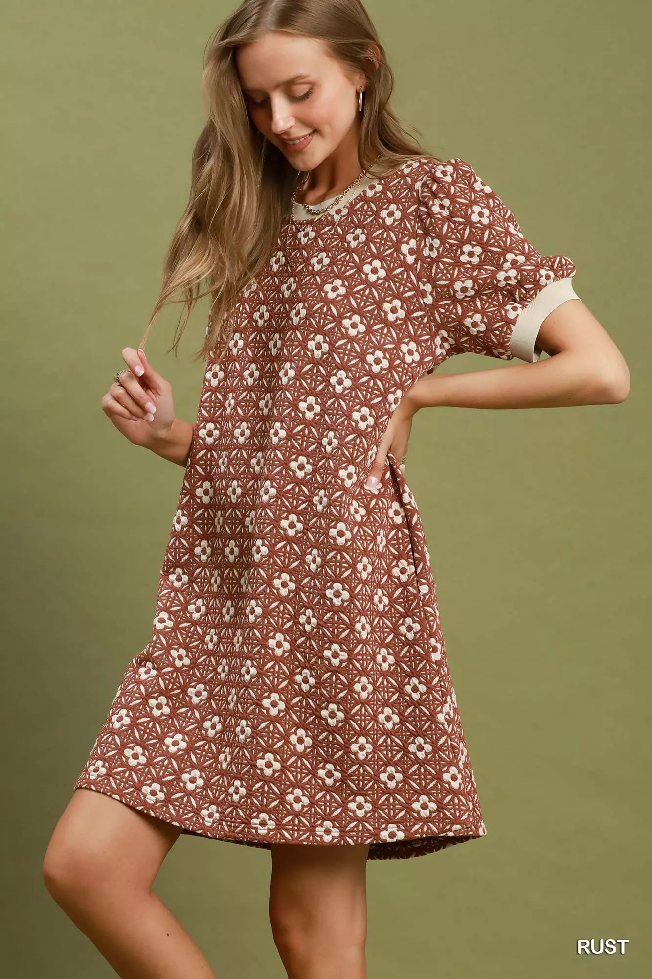 Umgee floral textured puff sleeve mini dress with a fitted bodice and ruffled hem, perfect for spring and summer wear.