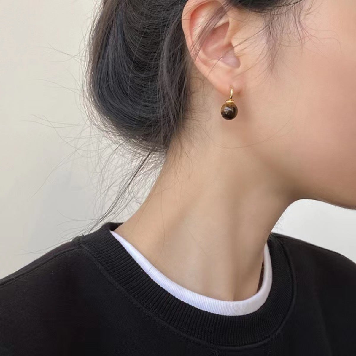 Tiger Eye Ball Drop Earrings from Plush Fashion Hub featuring polished tiger eye stones and elegant gold-tone hooks.