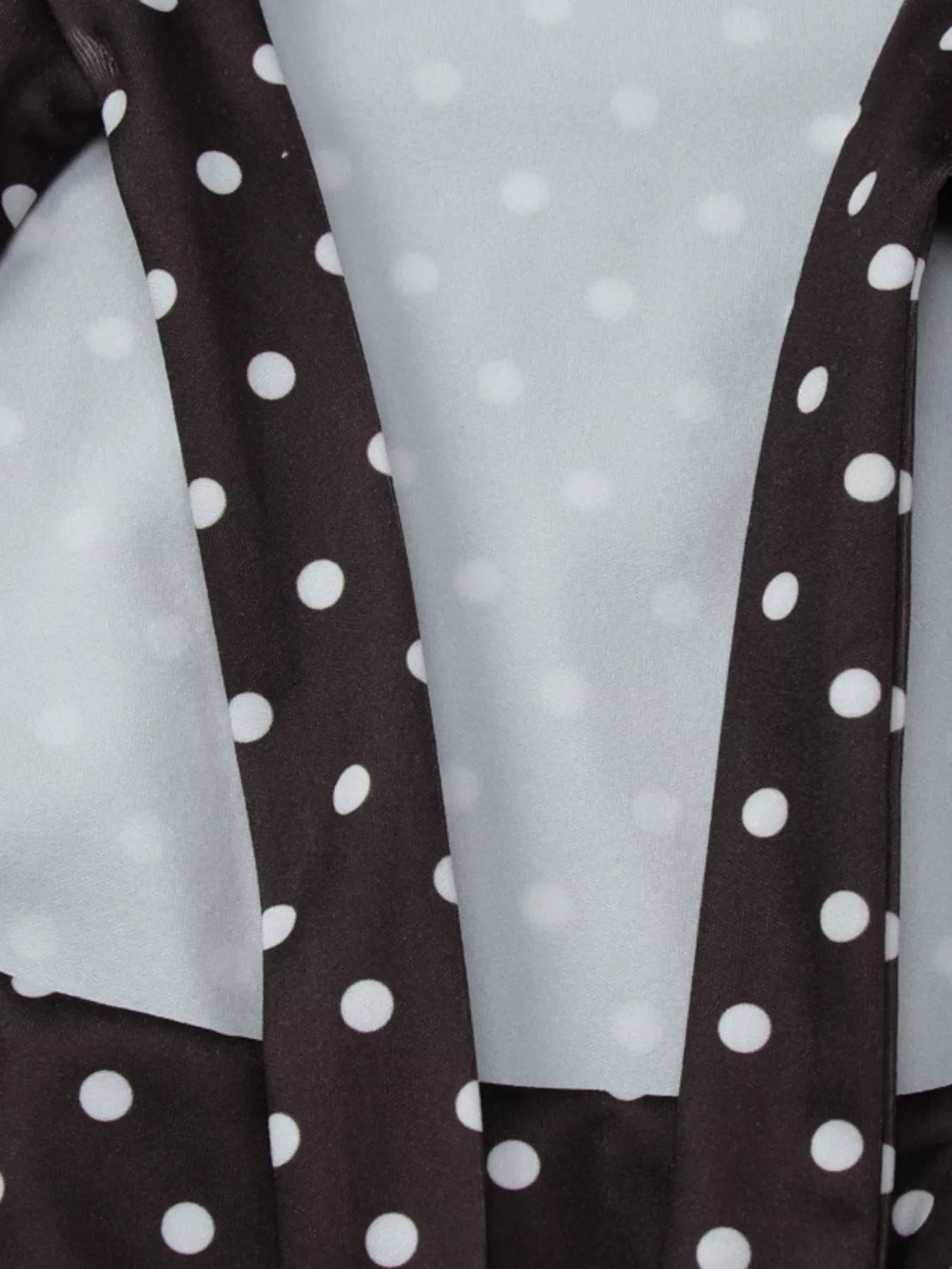Polka dot mini dress with cut-out front by Shopimist, featuring a stylish and playful design perfect for trendy occasions.